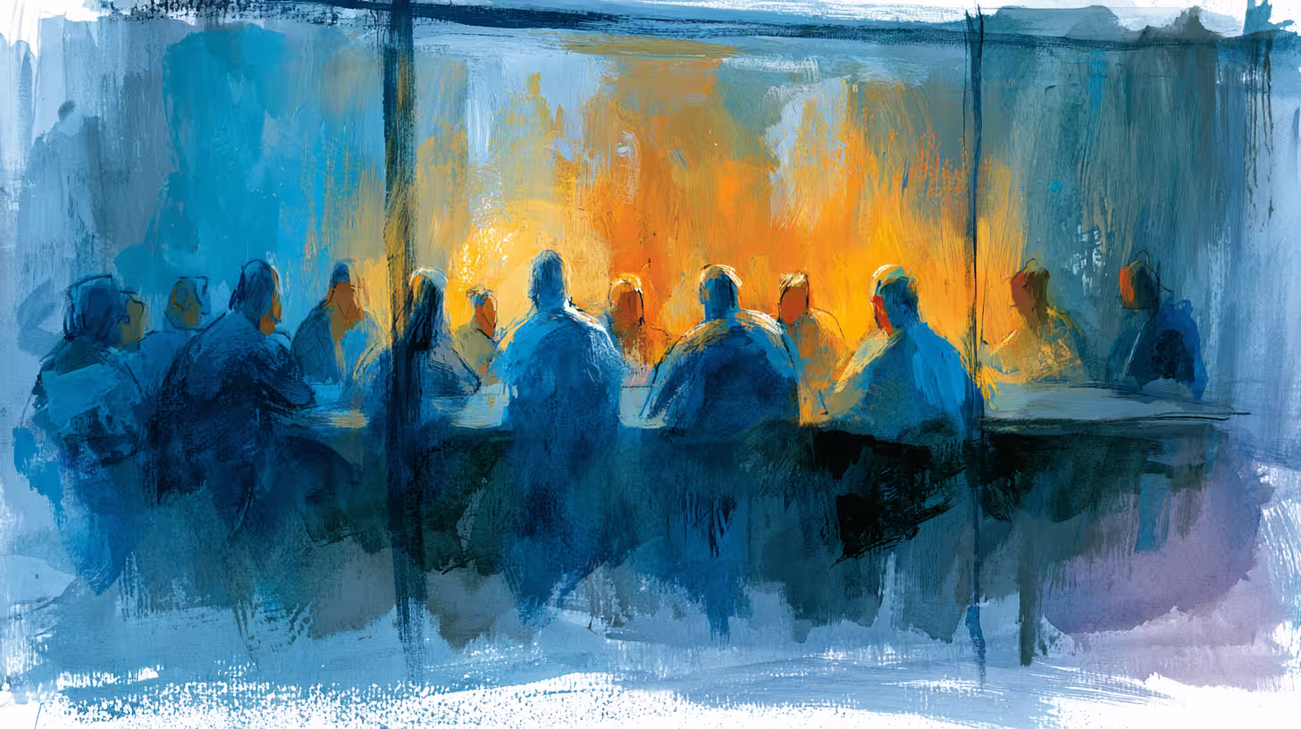 moody blue figures gathered around table in warm light