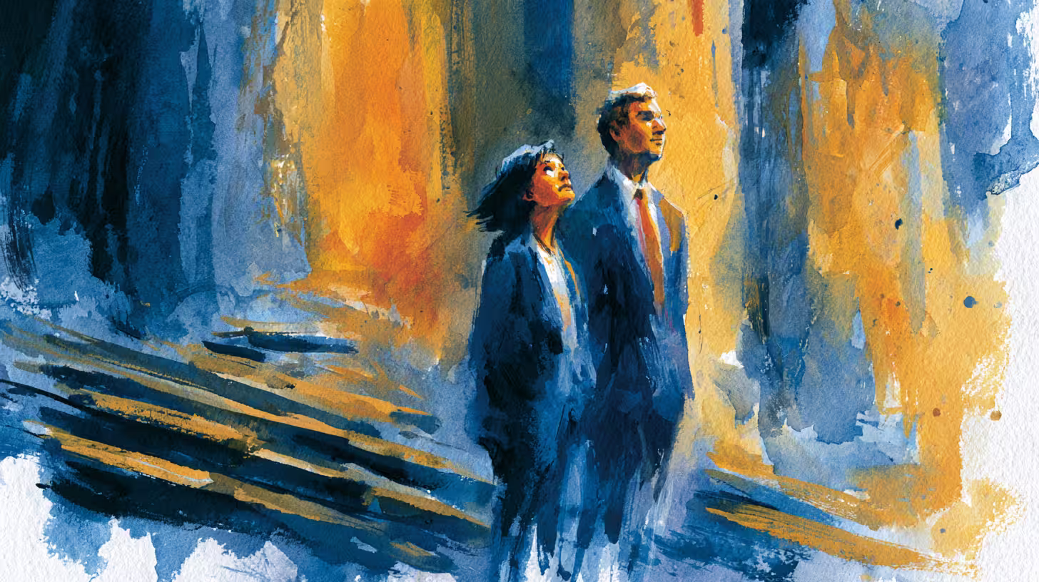 two business people walking through glowing city street at dusk